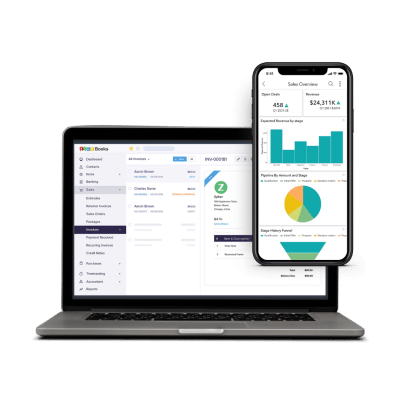 Open laptop and smartphone displaying financial software interface with charts and transaction details. Open laptop and smartphone displaying financial software interface with charts and transaction details.